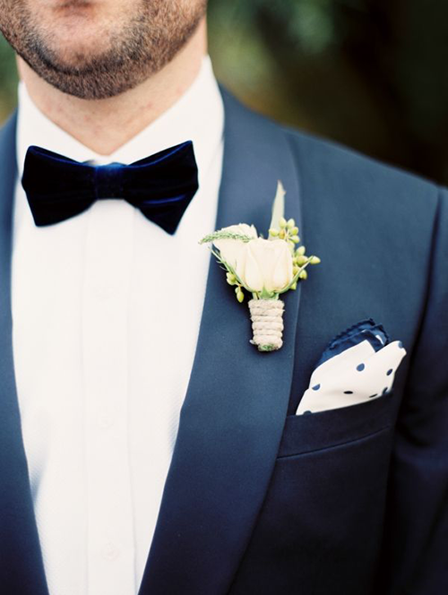 Groom wearing a midnight blue velvet bow tie Groom wearing a midnight blue velvet bow tie